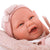 Papusa bebe realist Carla cu sac de dormit pufos, corp anatomic corect, roz pal, Antonio Juan