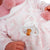 Papusa bebe realist Carla cu salteluta de schimbat, cu articulatii, roz, Antonio Juan